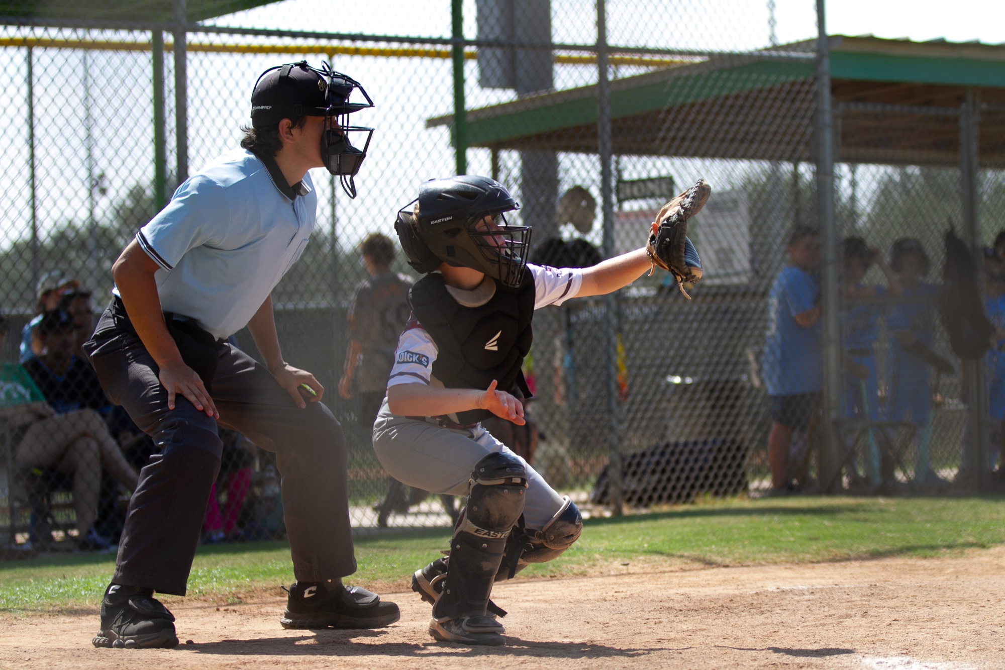 Rough Rider Youth catcher reaching for a pitch