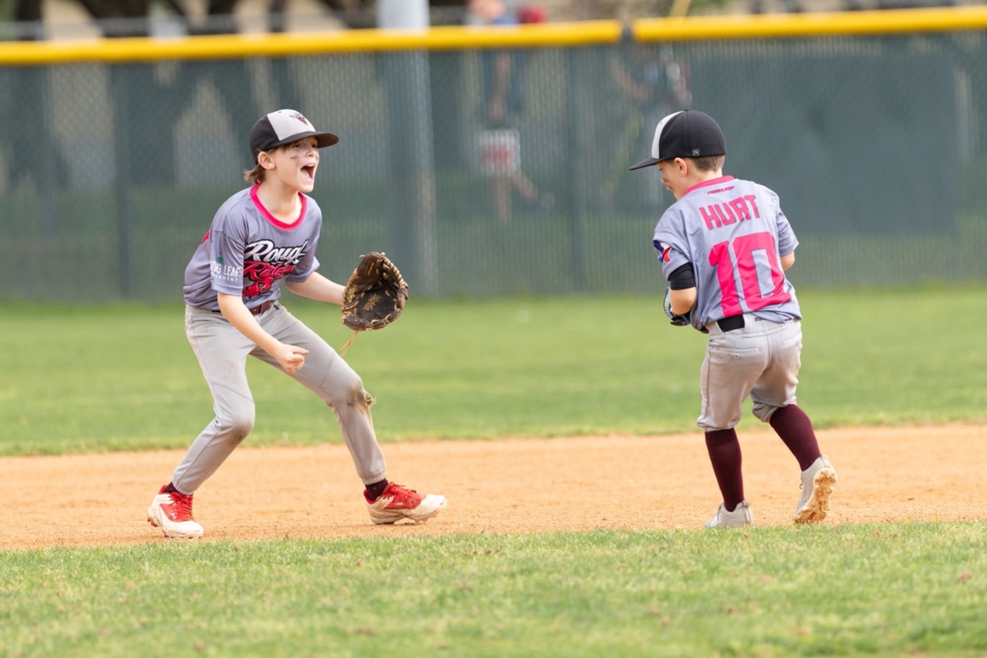 Rough Riders baseball teammates celebrating together