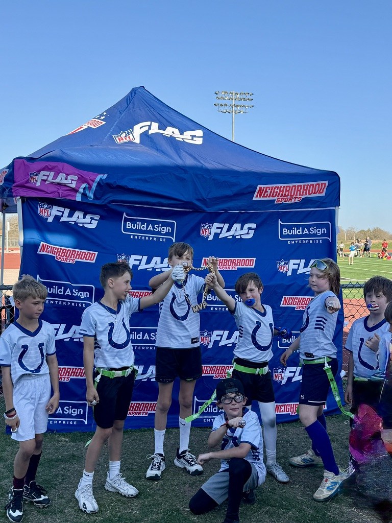 Rough Rider Youth flag football champions celebrating together