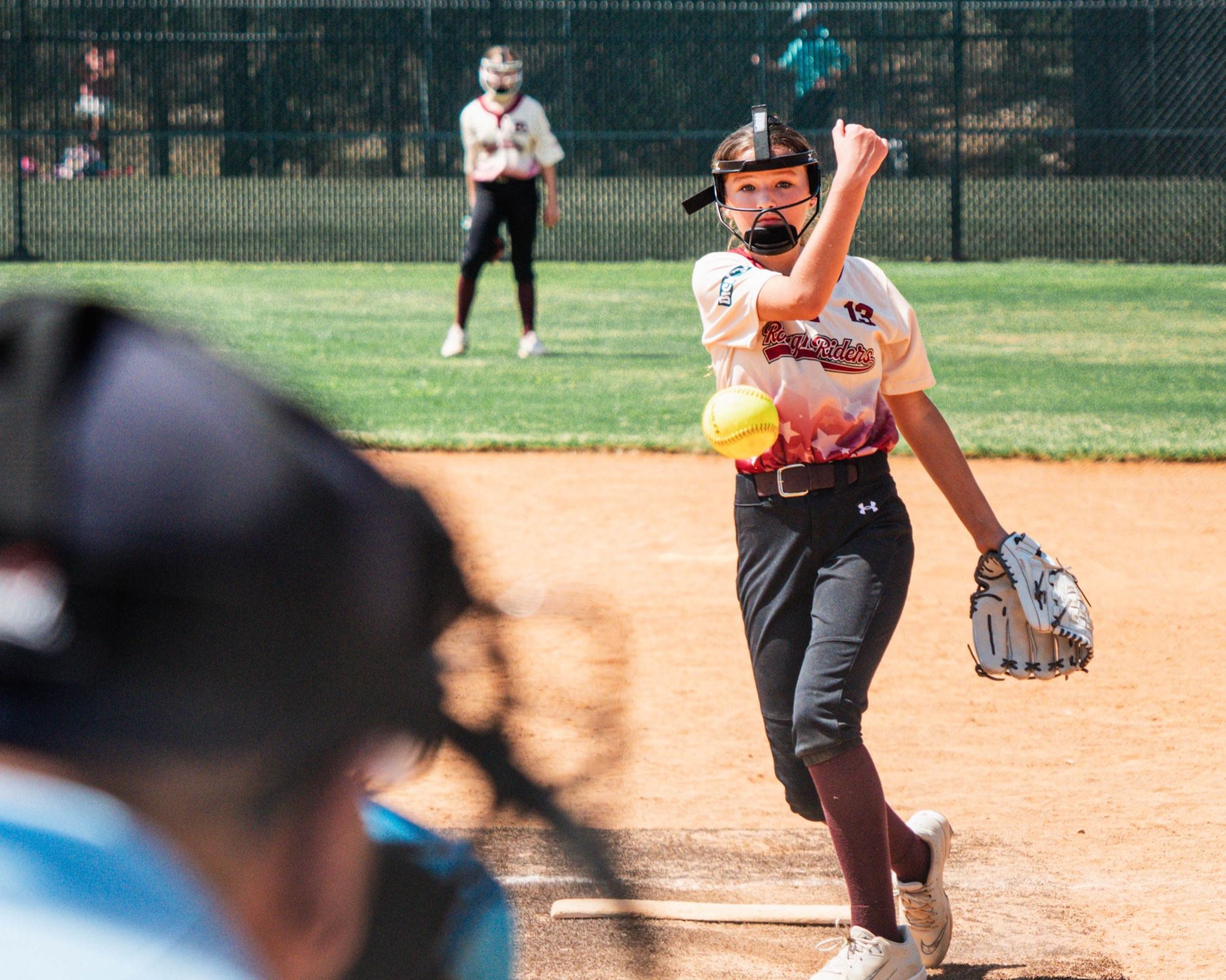 Rough Rider Youth softball pitcher releasing the ball