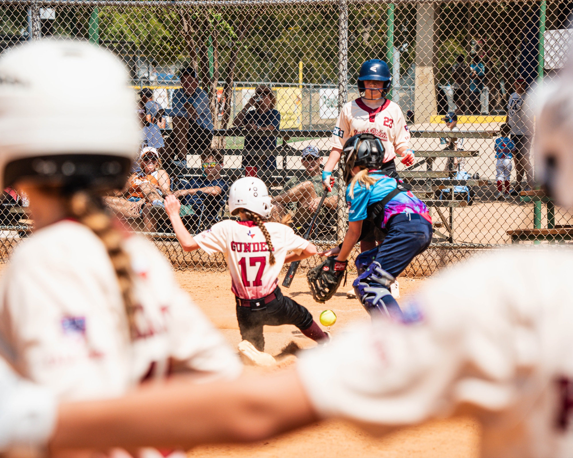 Rough Rider Youth softball player sliding home